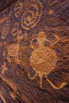 Ancient Anasazi rock art on red sandstone.