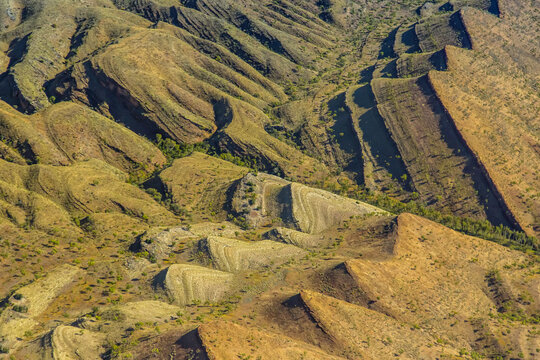 An aerial view of rock formations in Bungle Bungle Range, a UNESCO World Heritage Site in Purnululu National Park, located in the Kimberley Region of Northwest Australia.
