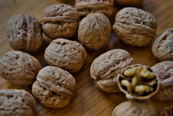 Walnuts and nutcraker on wooden board