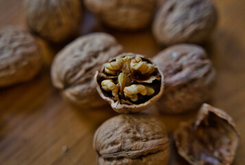 Walnuts and nutcraker on wooden board