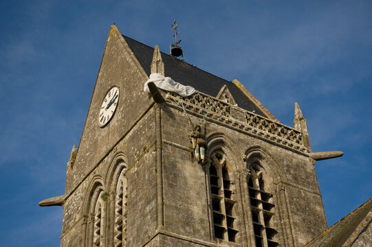 Close up of the top of a cathedral in Sainte-Mere-Eglise, France. This is where a paratrooper got caught up on the steeple during the D-Day Invasion in 1944; Sainte-Mere-Eglise, Normandy, France