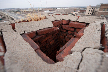 Top of an old brick chimney on a roof; Lincoln, Nebraska, United States of America