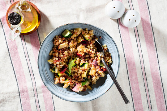 salad from Sardinian fregula pasta on the table.