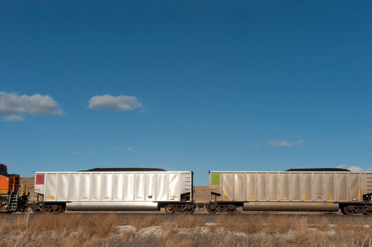 Coal train along the highway in Nebraska, USA; Thedford, Nebraska, United States of America