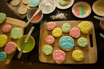 Happy and sad sugar cookies on a cutting board; Lincoln, Nebraska, United States of America