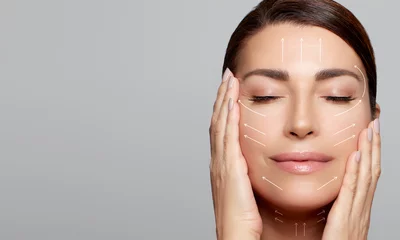 Beauty and Aged Skin Care Concept. Natural Woman Face with Healthy Flawless Skin and Lifting Arrows over face. © Casther
