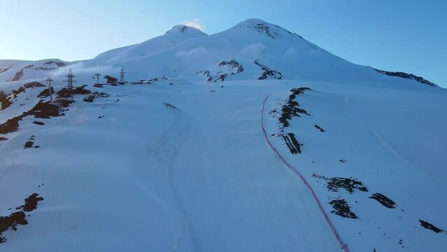 Aerial view of the two-headed peak of Mount Elbrus at sunset