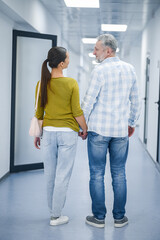 A couple in the clinic corridor after diagnostic procedure