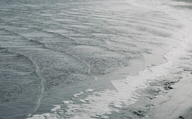 Bay of the lake with space for text. Texture waves shore with sunlight. Lake Leucate in the south of France in Languedoc Roussillon in France. Landscape in Luecate, Aude.  