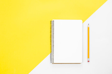 Blank notepad on colored background, flat lay.