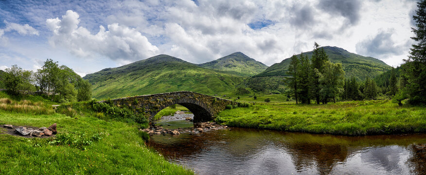 Panoramic view of Butter Bridge over Kinglas Water in the Loch Lomond National Park in Scotland.