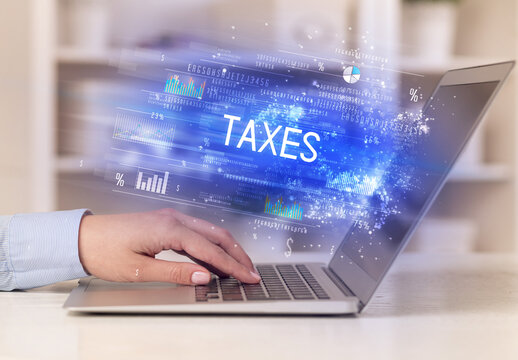 Closeup Of Businessman Hands Working On Laptop