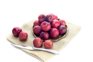 Ripe plums in a plate close-up