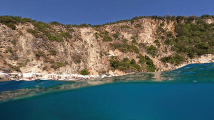 Underwater split sea level photo of famous paradise beach of Agiofili in island of Lefkada, Ionian, Greece