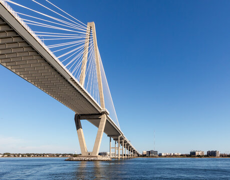 Wide angle view of Arthur Ravenel Jr. Bridge in Charleston, South Carolina, on a bright blue sunshine day.