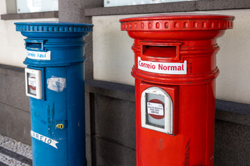 Funchal, Madeira, Portugal - August 5 2022: Two portuguese mailboxes on the street in Funchal