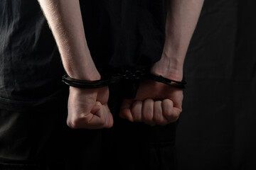 A man, a criminal in handcuffs.Criminal news.Detention of a criminal.