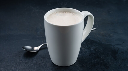 Raf coffee with milk in a white ceramic mug.