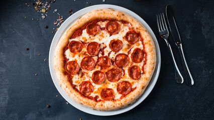 Pepperoni pizza with mozzarella, tomato sauce on a thick dough.