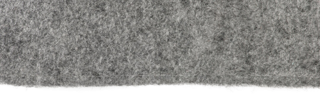 Felt texture. Texture of gray felt isolated on white background. Abstract background with natural gray felt. High resolution texture photo