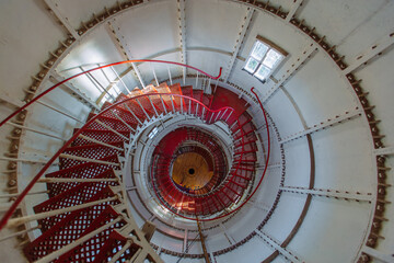 Iron spiral staircase inside the old lighthouse, top view