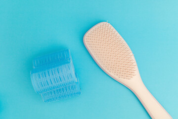 Blue hair curlers on a blue background