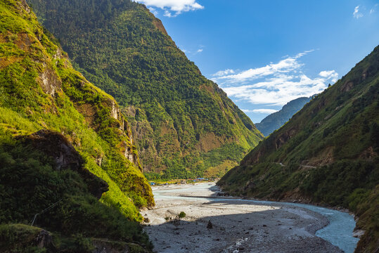 River and Valley along the Annapurna circuit trek path with the village of Tal in the distance, Nepal © MotionLoop