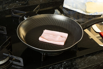 woman preparing hot cheese sandwich on morning breakfast