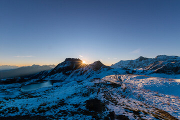 sunrise over the snowy mountains during spring (Tilisunasee, Tschagguns, Vorarlberg, Austria)