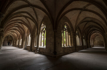 Aisle of a historic monastery.