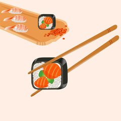 Rolls and sushi with shrimp and red fish on a wooden tray