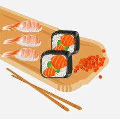 Rolls and sushi with shrimp and red fish on a wooden tray