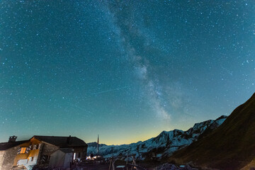 starry night sky in the alps with a mountain hut (Austria)
