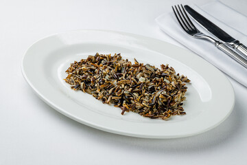 wild black rice boiled on white plate