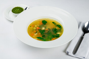 Vegetable soup minestrone on a white plate