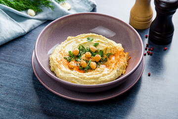 Traditional homemade hummus on table side view