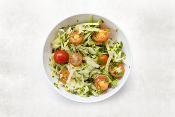 delicious green salad with tomatoes in bowl
