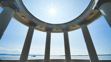 Fototapeta na wymiar White rotundas in the city near the waterfront.