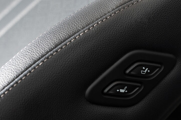 Car seat adjustment buttons