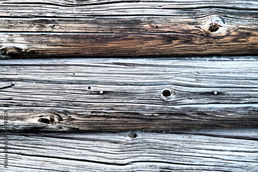 Poster background horizontal logs. wooden background from shabby boards and logs. round lumber assortment. 