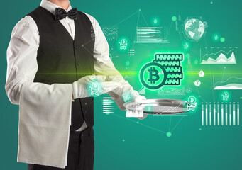 Handsome young waiter in tuxedo holding currency icons on tray