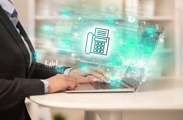Young man watching stock market on laptop