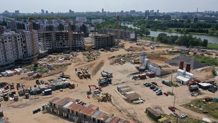Obraz premium Minsk, Belarus - 01.08.2022: Panoramic view of a huge construction site in the center of Minsk. Construction of a residential complex in the capital of Belarus. How residential skyscrapers are built.