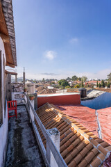 Fototapeta na wymiar Beautiful sunny day in mountain city in Mexico. The famous tiled roofs of the city.
