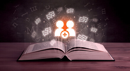 Open book with social networking icons above