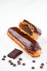 chocolate eclair, Traditional french dessert eclair with custard and chocolate icing