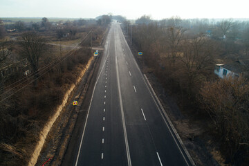 Aerial view asphalt road and green forest, Forest road going through forest with car adventure view from above, Ecosystem and ecology healthy environment concepts and background.