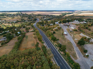 Fototapeta na wymiar Aerial view asphalt road and green forest, Forest road going through forest with car adventure view from above, Ecosystem and ecology healthy environment concepts and background.