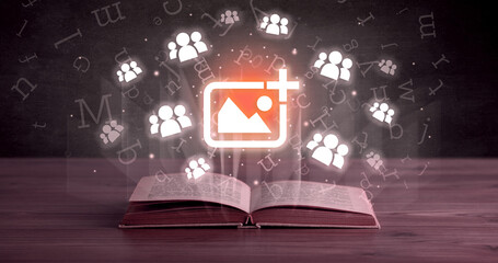 Open book with social networking icons above