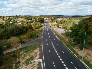 Obraz premium Aerial view asphalt road and green forest, Forest road going through forest with car adventure view from above, Ecosystem and ecology healthy environment concepts and background.